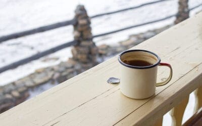 Extreme cold preparedness tips, featuring a coffee mug against a snowy backdrop