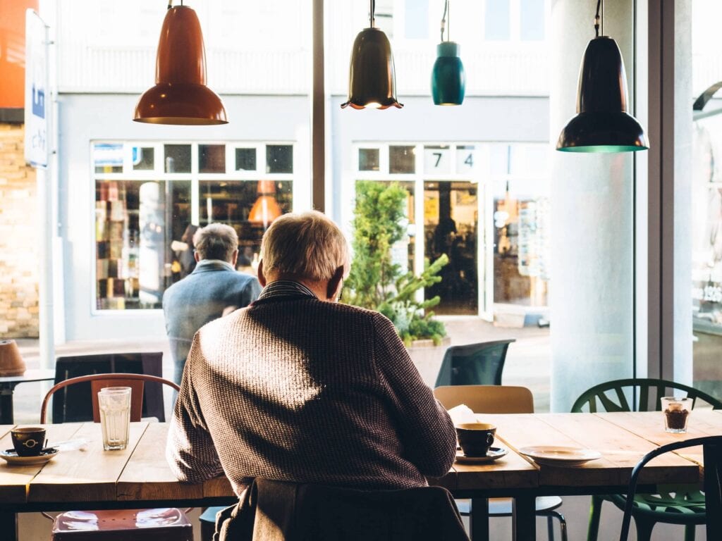 man sitting at a cafe