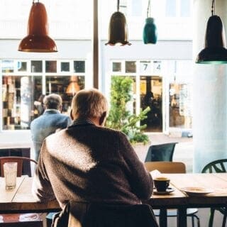 man sitting at a cafe