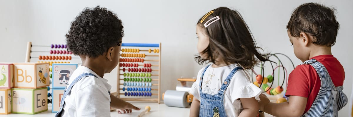 Young children playing with educational toys