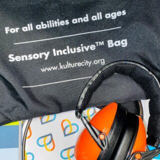 JCPH has partnered with KultureCity® to earn Sensory Inclusive™ Certified status and accommodate guests with sensory needs. This image shows noise cancelling headphones, fidget toys, and communication cards.