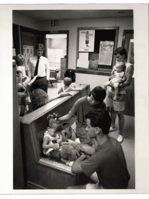 UH-Archive_photoFrame Vintage photo of babies and parents in waiting room.