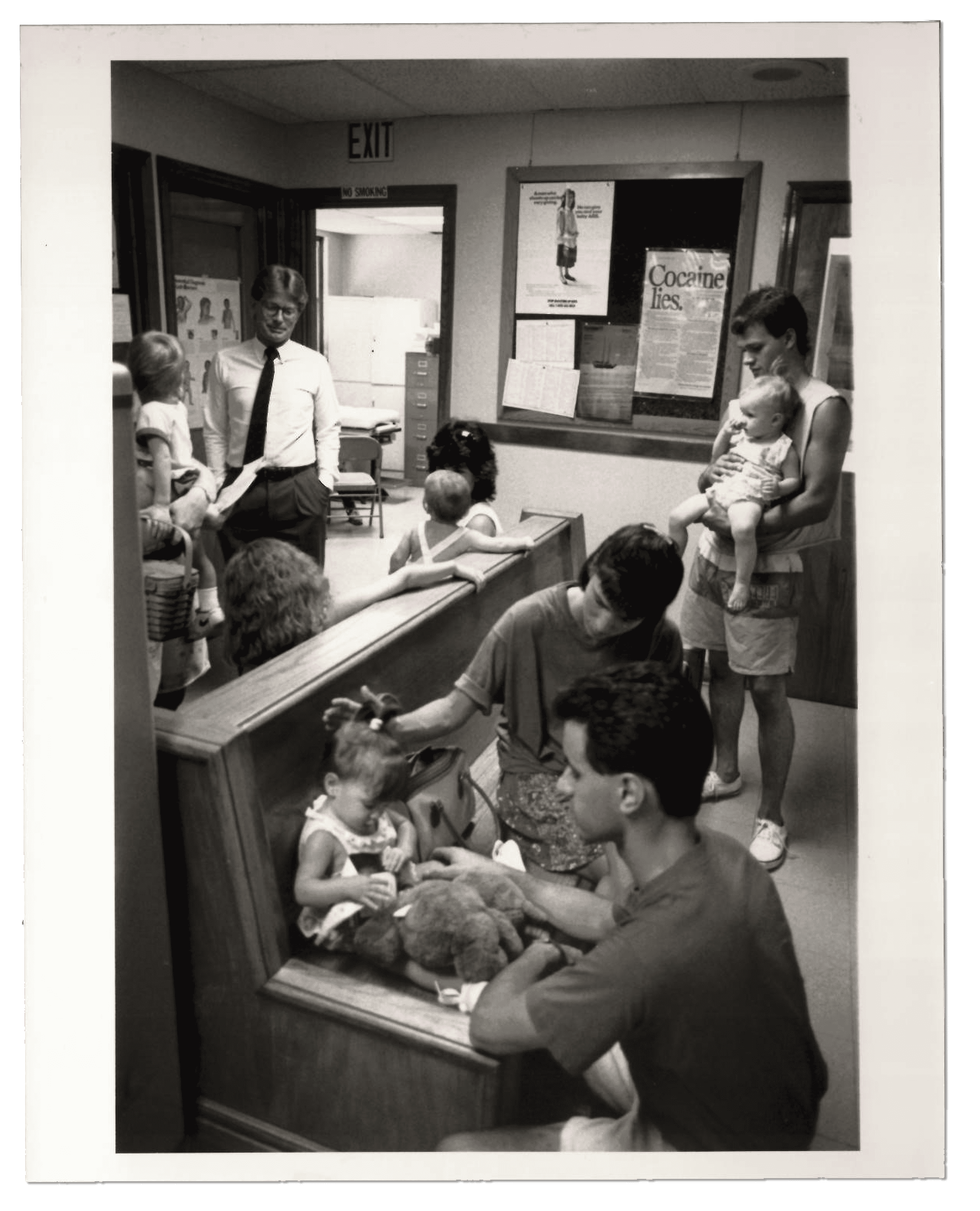 Vintage photo of babies and parents in waiting room.